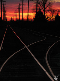 Photo: Train tracks at sunset